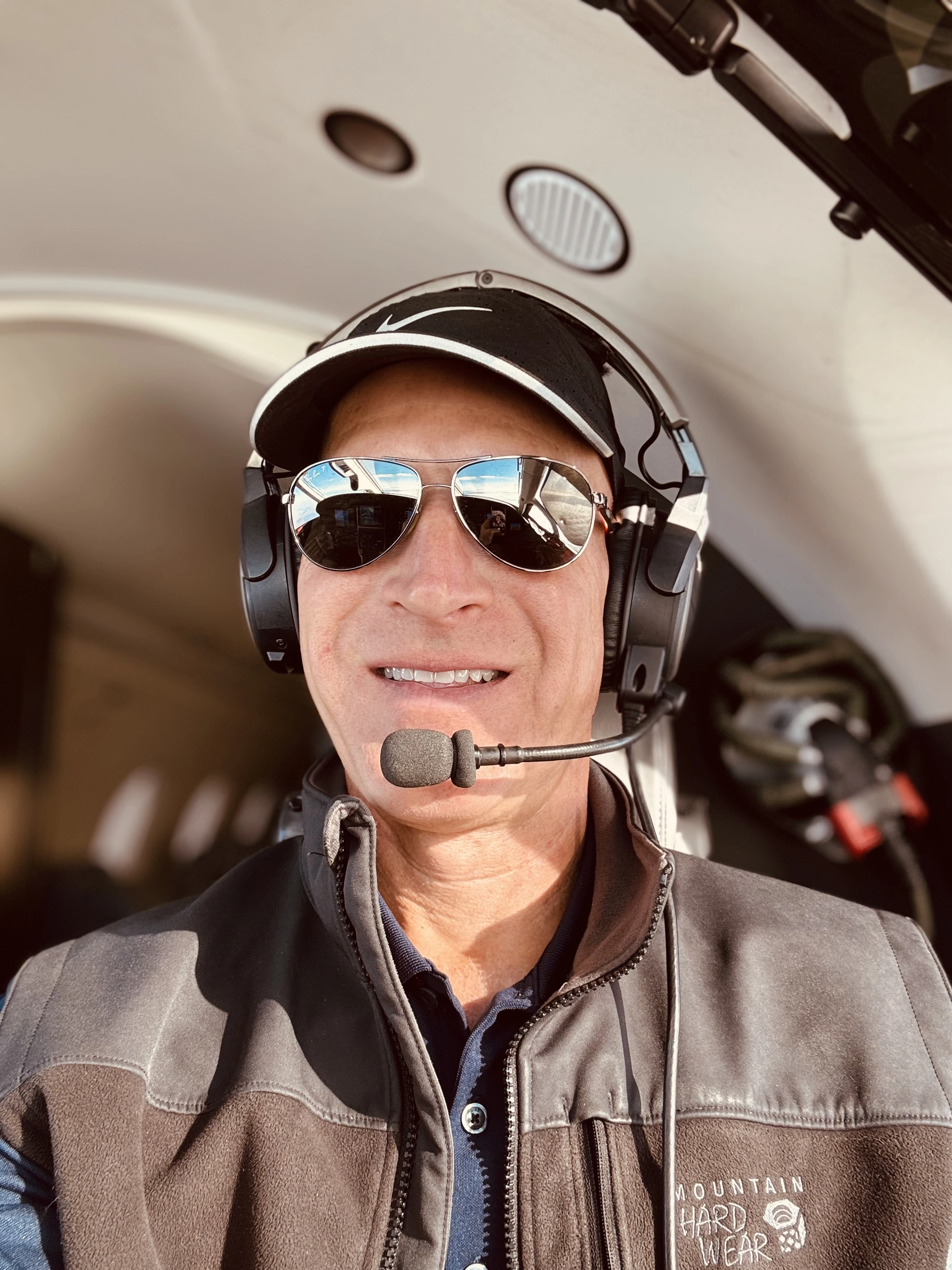 Joe Ratterman wearing a headset in an airplane cockpit